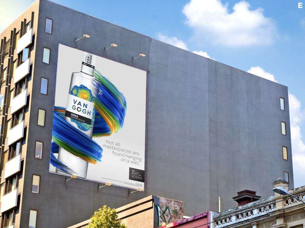 Large-scale Van Gogh Vodka billboard reading 'Not all masterpieces are found hanging on a wall' on the side of a city building