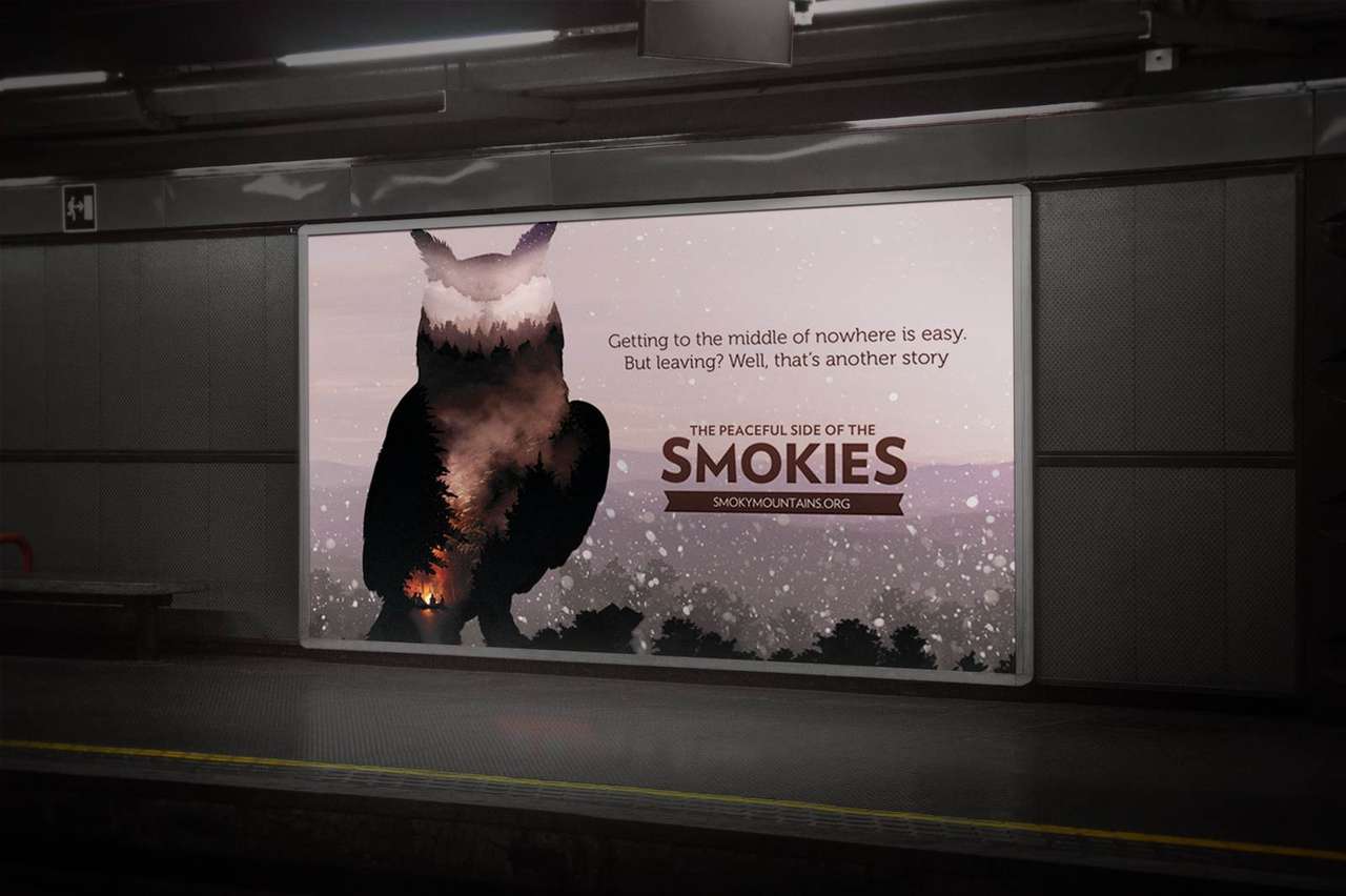 Peaceful Side of the Smokies owl key art on a transit tunnel billboard with the line, Getting to the middle of nowhere is easy, but leaving, well, that's another story